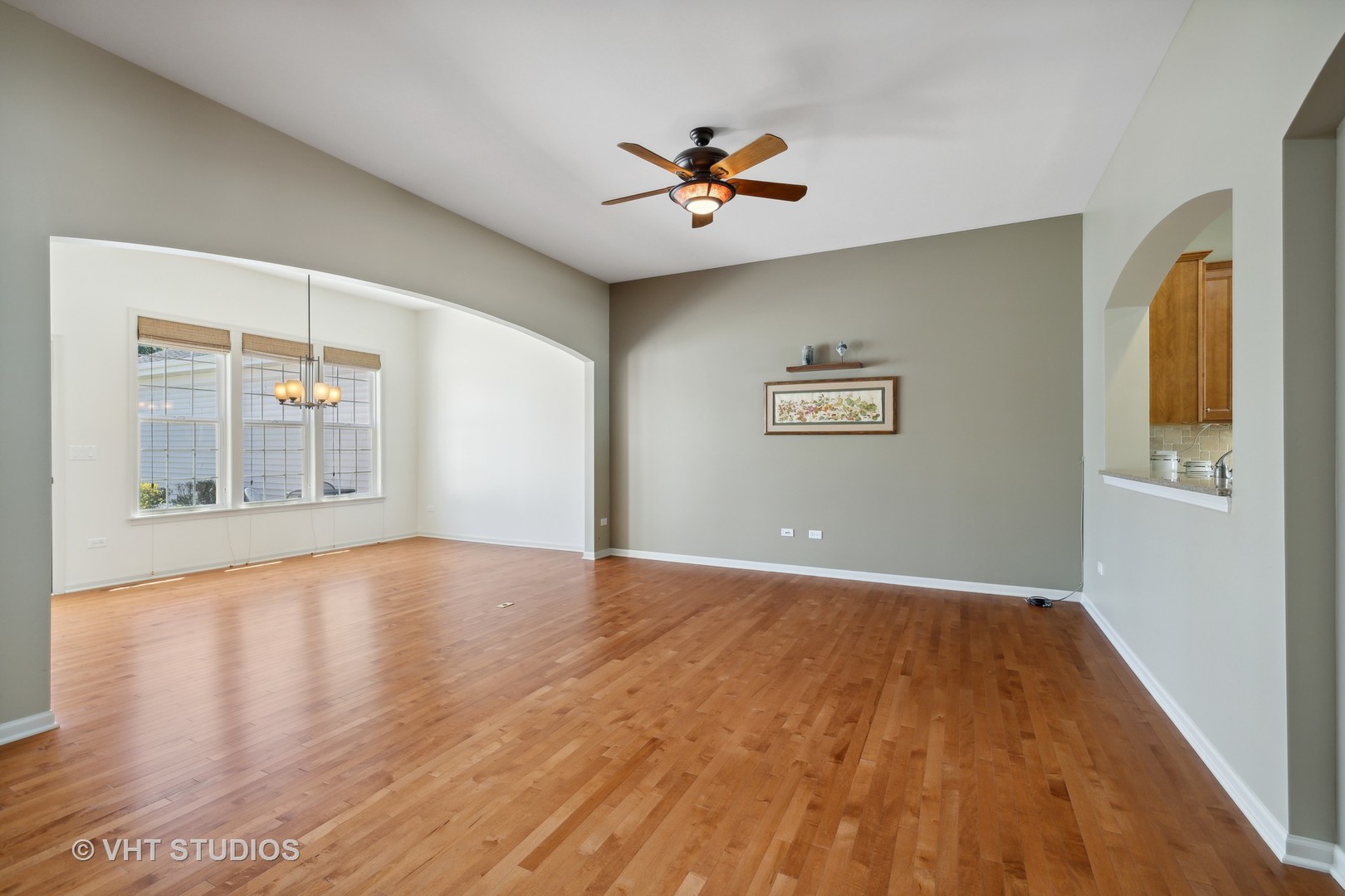 2944 Normandy Circle Naperville, IL 60564 - Photo 8 of 38 a view of an empty room with wooden floor and a window