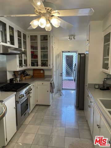 a kitchen with a stove and a refrigerator