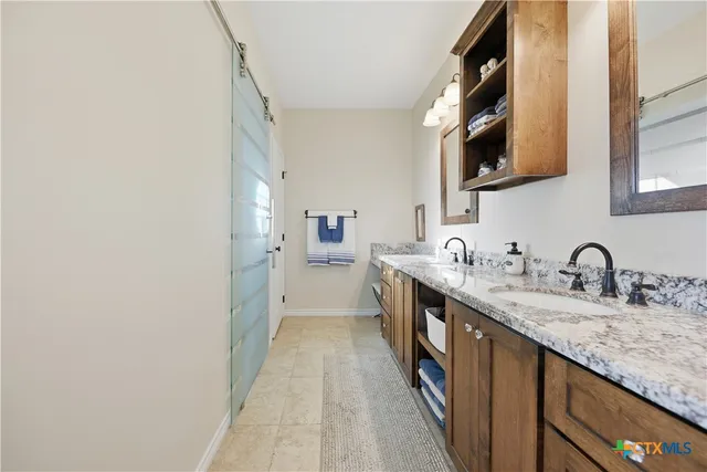 a kitchen with stainless steel appliances granite countertop a sink and dishwasher a stove with wooden floor