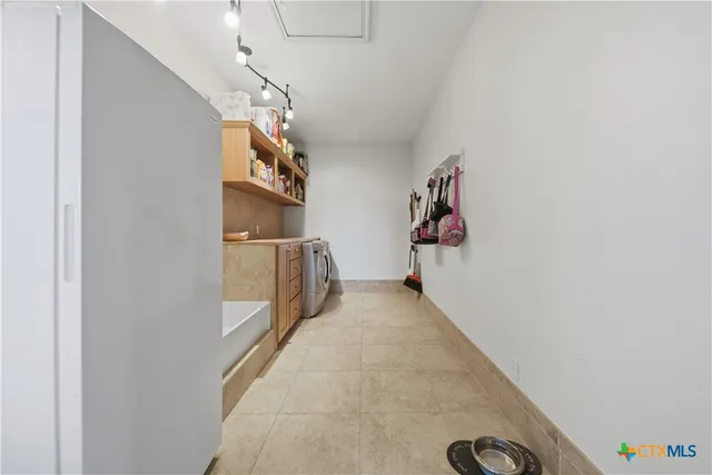 a living room with a bed furniture and a wooden floor