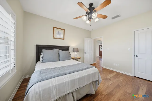 a view of a porch with furniture and a yard