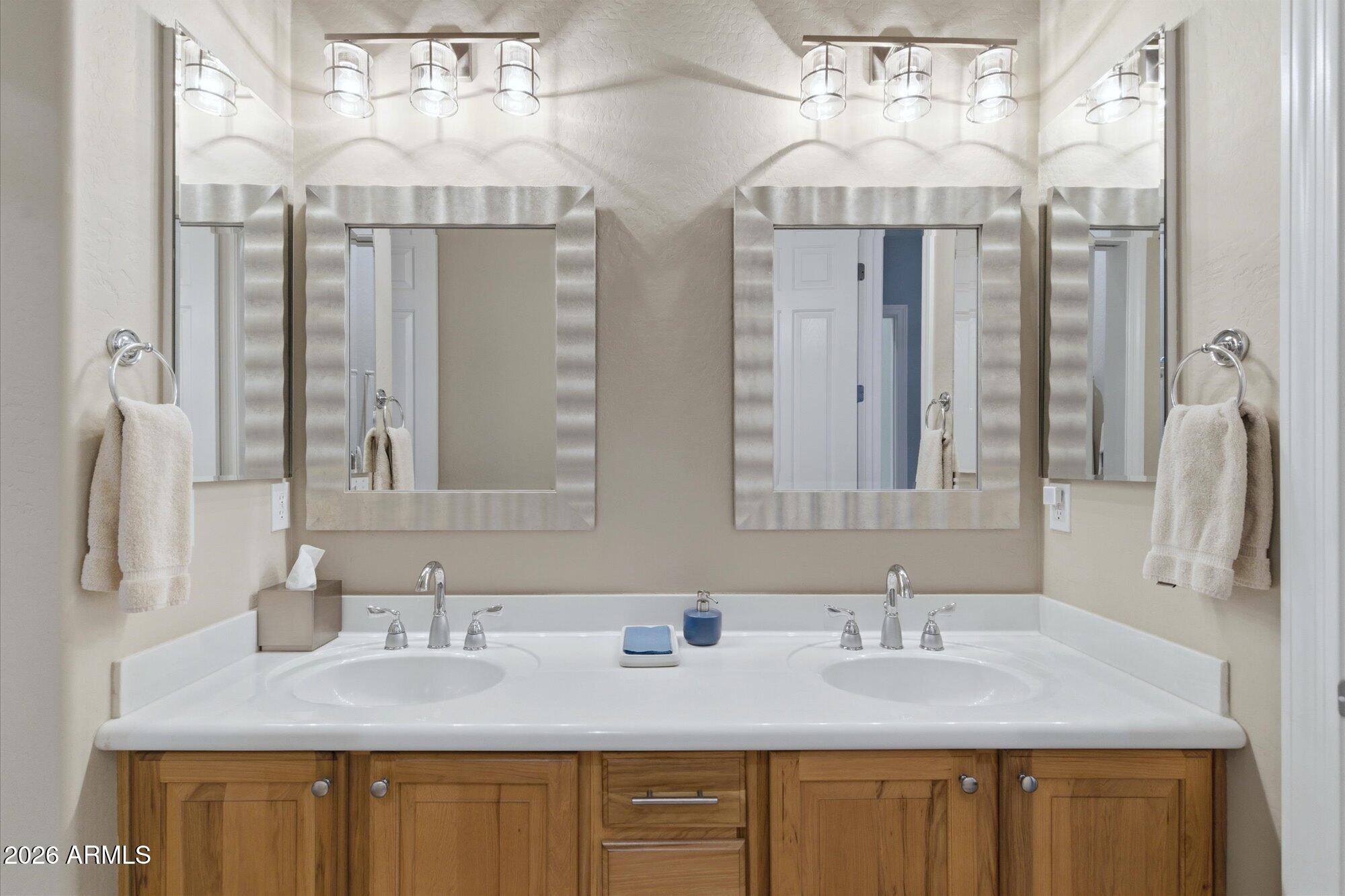 40322 North Hawk Ridge Trail Anthem, AZ 85086 - Photo 35 of 63 a bathroom with a granite countertop double vanity sink and mirror