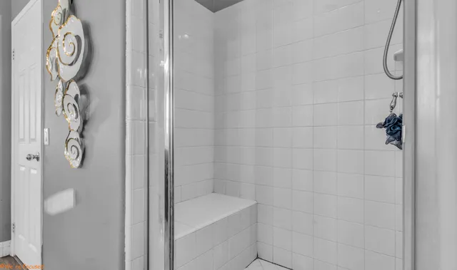 a bathroom with a shower curtain and a sink