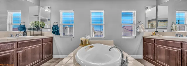 a spacious bathroom with a sink and a bathtub