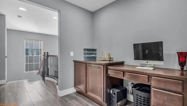 a room with furniture and wooden floor