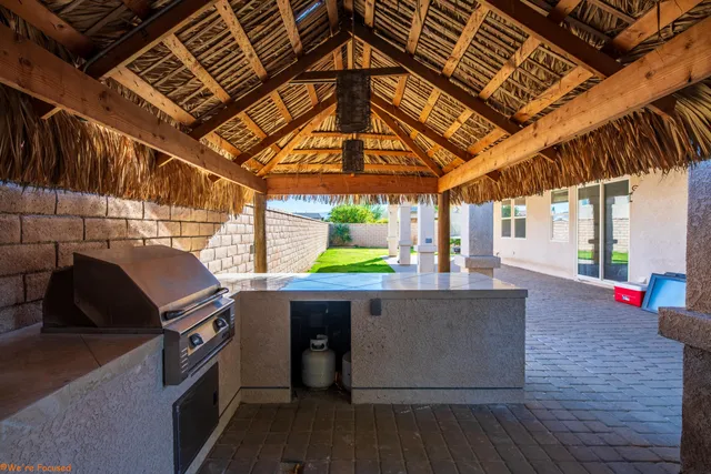a room with wooden floor and pool table