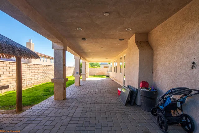 a view of a room with gym equipment and floor to ceiling window