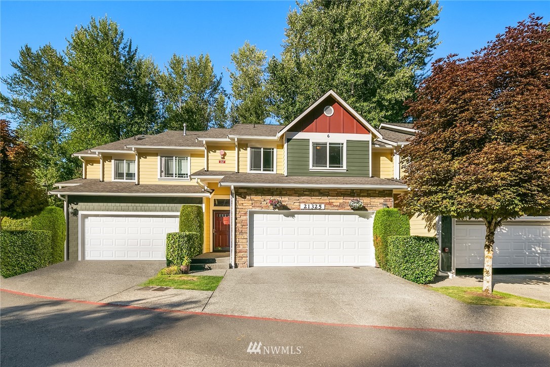 21325 11th Drive Southeast Bothell, WA 98021 - Photo 1 of 27 a front view of a house with a yard and garage