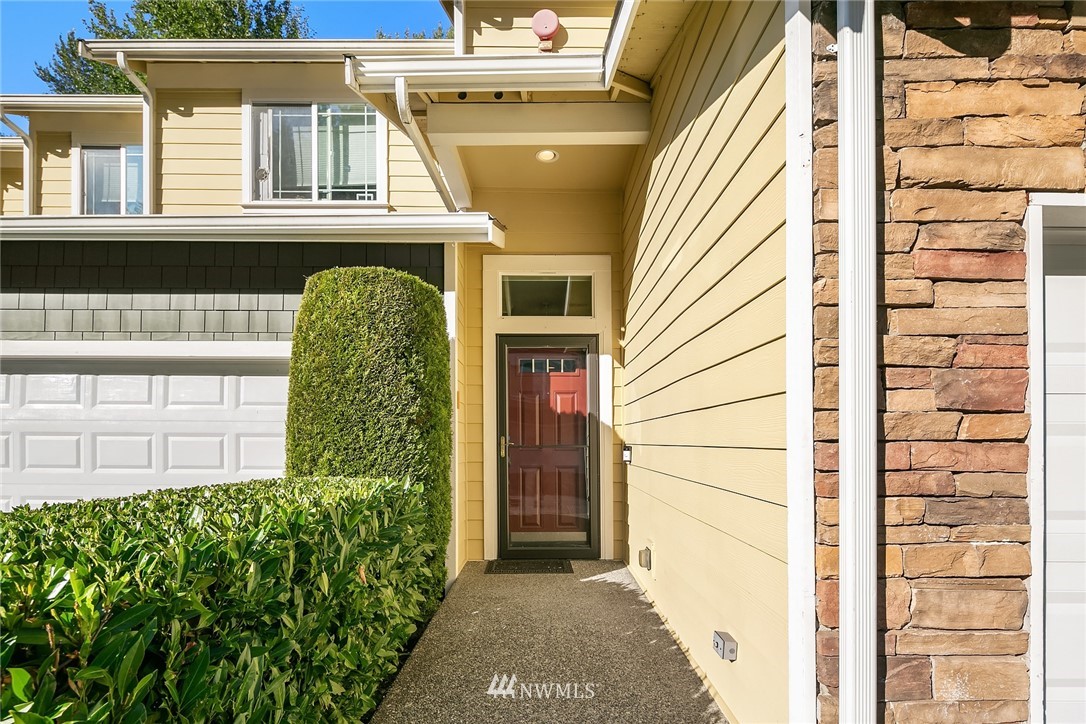 21325 11th Drive Southeast Bothell, WA 98021 - Photo 2 of 27 a view of a house with a small yard and wooden floor and fence