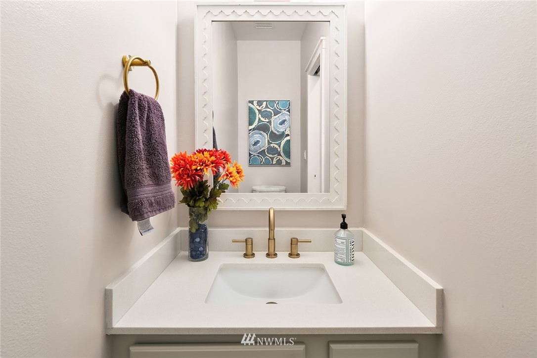 21325 11th Drive Southeast Bothell, WA 98021 - Photo 13 of 27 a bathroom with a sink and a mirror