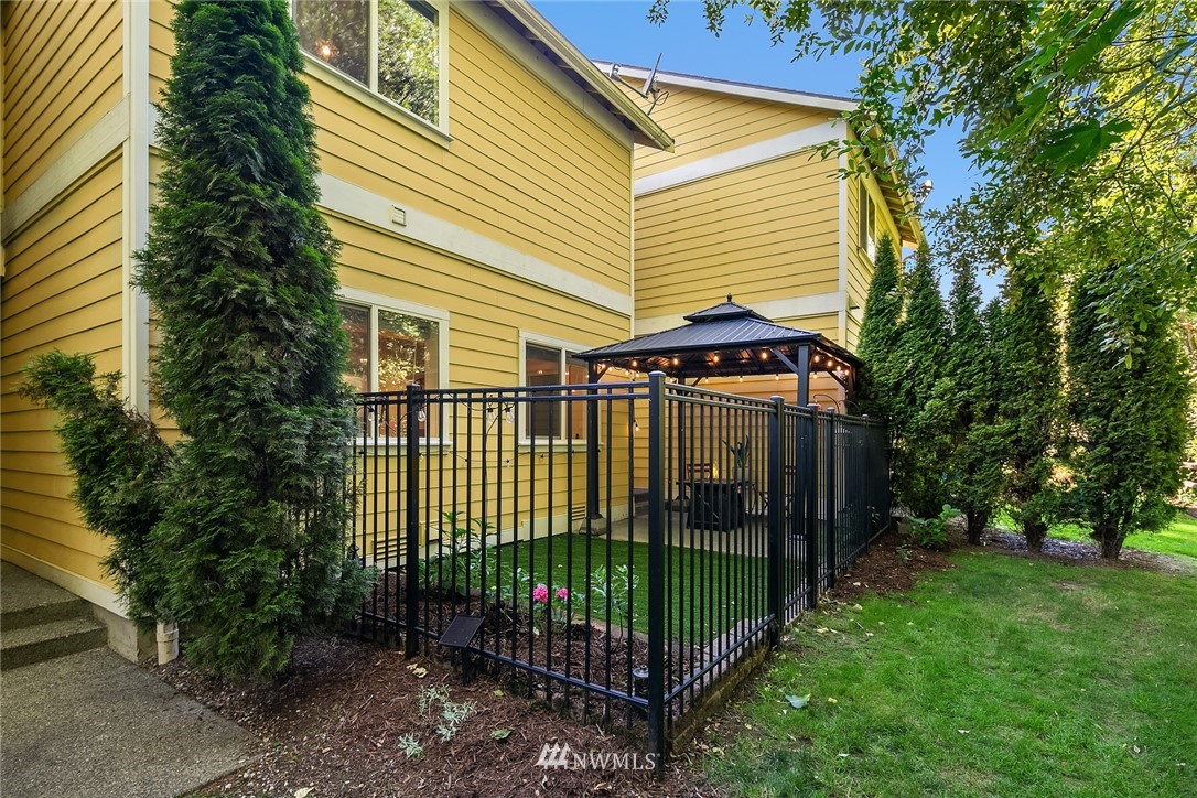 21325 11th Drive Southeast Bothell, WA 98021 - Photo 15 of 27 a view of a house with a small yard and plants