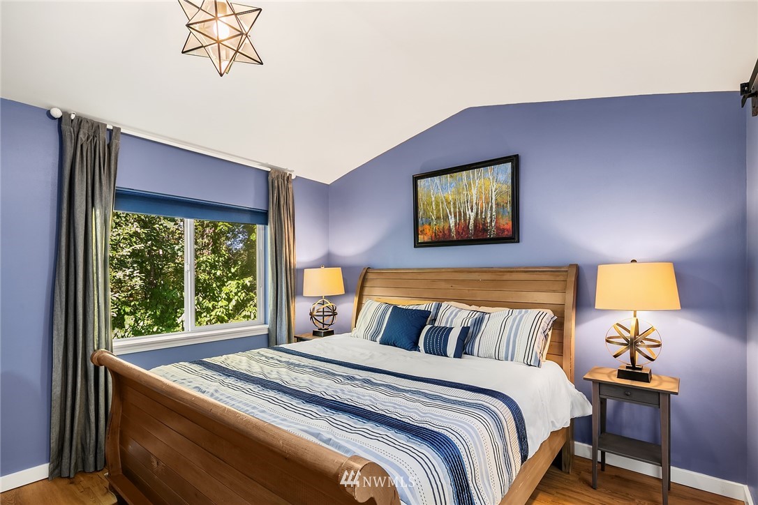 21325 11th Drive Southeast Bothell, WA 98021 - Photo 19 of 27 a bed sitting in a bedroom next to a window