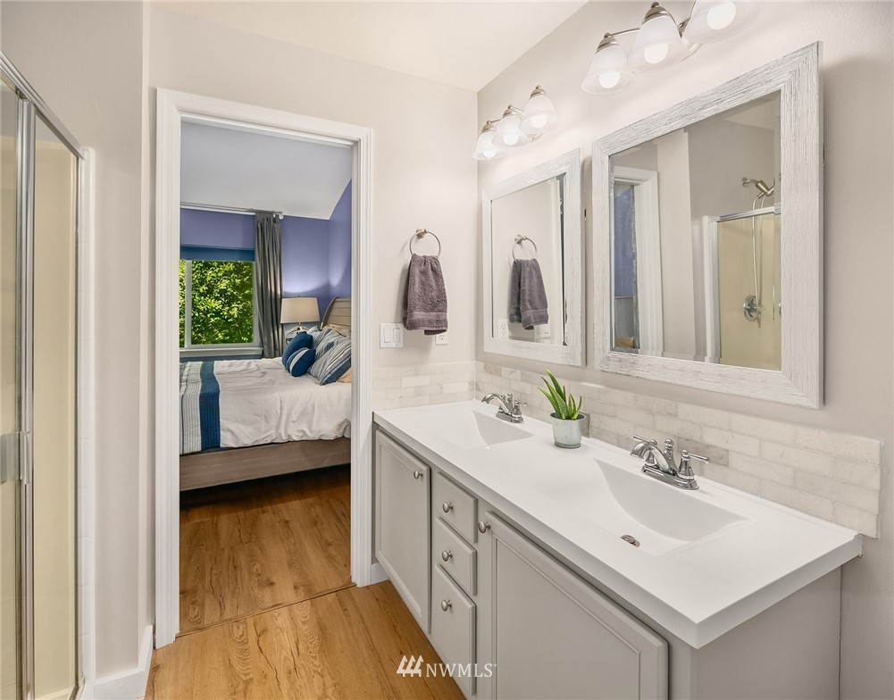21325 11th Drive Southeast Bothell, WA 98021 - Photo 20 of 27 a en suite bathroom with a sink double vanity and mirror
