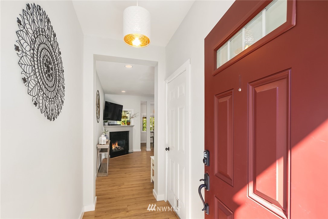 21325 11th Drive Southeast Bothell, WA 98021 - Photo 3 of 27 a view of a hallway with wooden floor and furniture