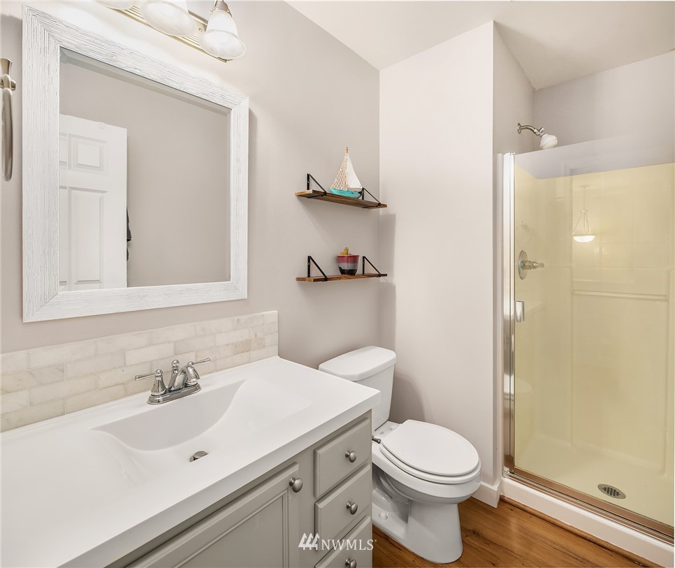 21325 11th Drive Southeast Bothell, WA 98021 - Photo 23 of 27 a bathroom with a sink toilet and shower