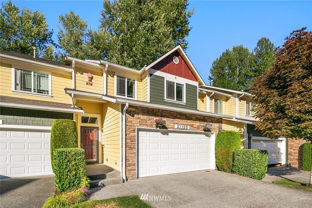 21325 11th Drive Southeast Bothell, WA 98021 - Photo 26 of 27 a front view of a house with a yard and garage