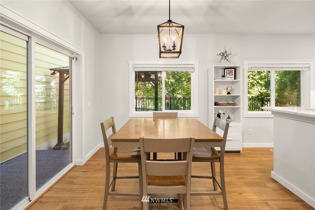 21325 11th Drive Southeast Bothell, WA 98021 - Photo 9 of 27 a dining room with wooden floor and window