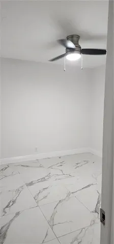 a view of kitchen with sink and window