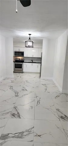 a bathroom with a toilet a sink and shower