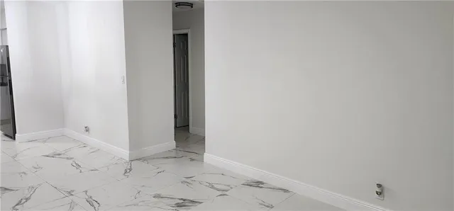 a view of a refrigerator in kitchen and dishwasher