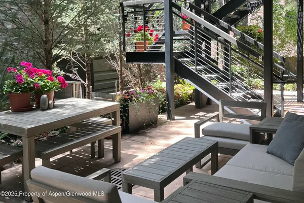 a outdoor space with lots of white furniture