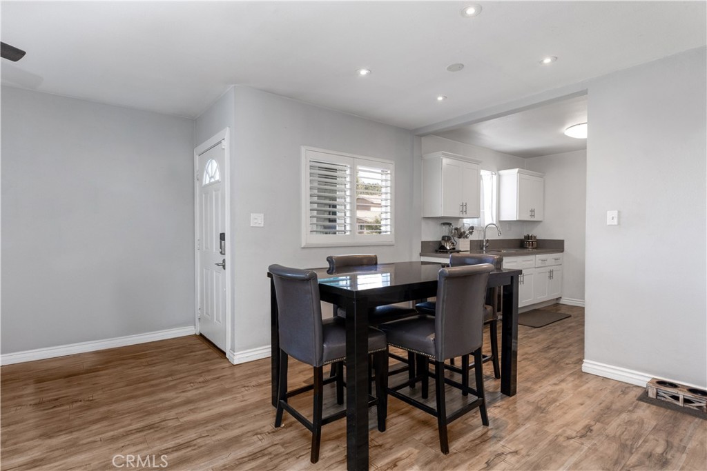 1423 South Gunlock Avenue Compton, CA 90220 - Photo 6 of 28 a kitchen with a table and chairs in it