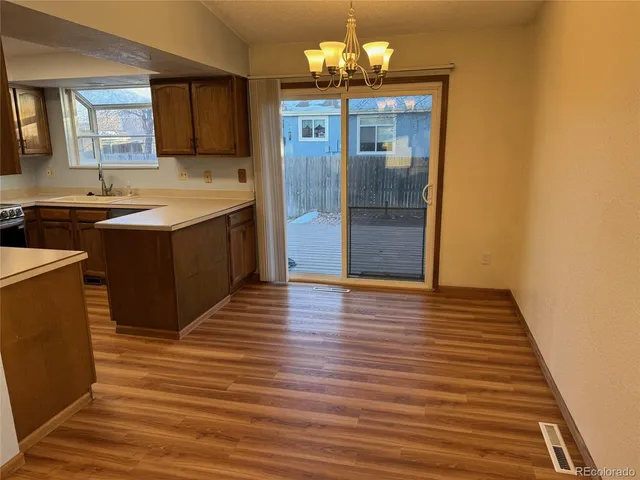 a kitchen with stainless steel appliances granite countertop a sink counter space and cabinets