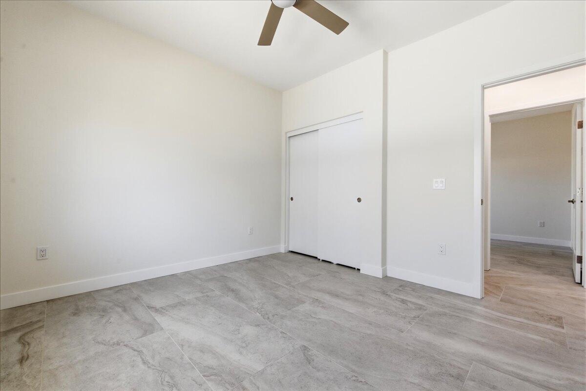 68160 Modalo Road Cathedral City, CA 92234 - Photo 47 of 57 an empty room with ceiling fan and window