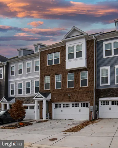 a front view of a building with lot of windows