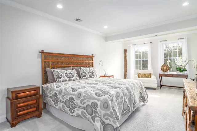 a bedroom with a bed and a couch