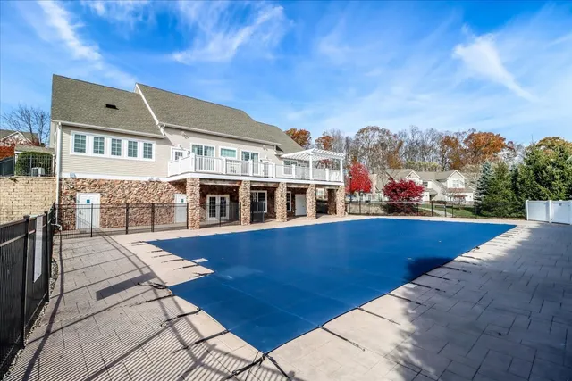 a view of a swimming pool with a lounge chairs
