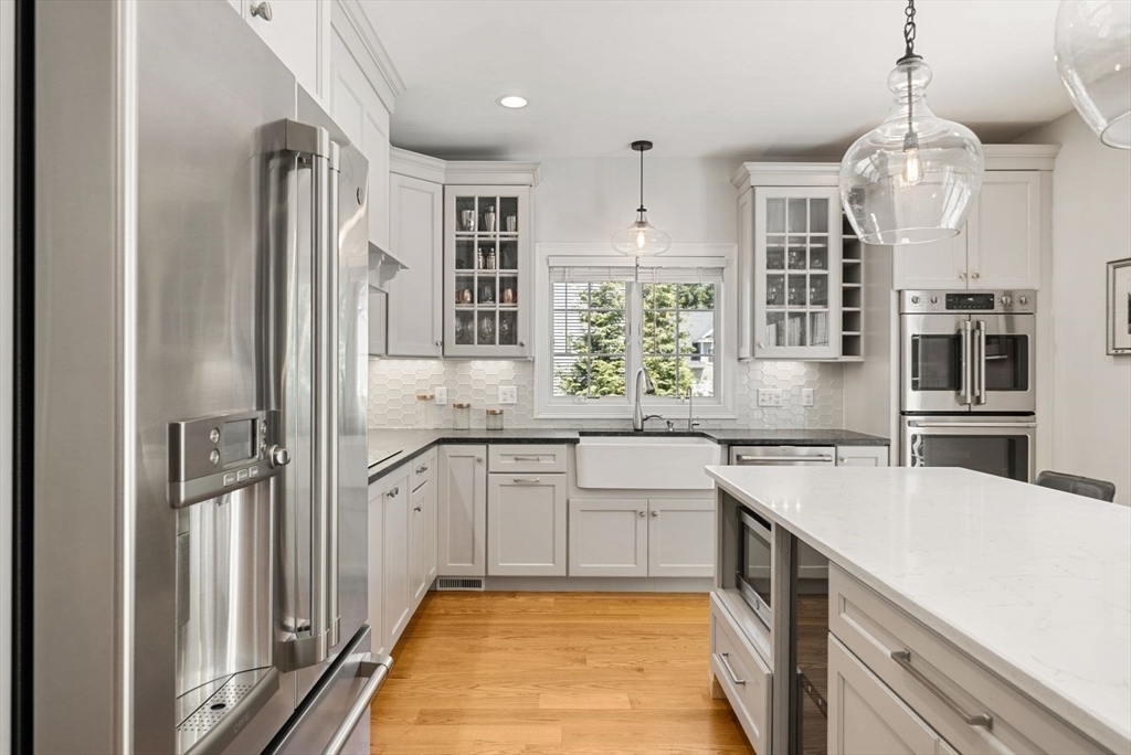 185 Bailey Street Canton, MA 02021 - Photo 12 of 42 a kitchen with granite countertop a sink stainless steel appliances and cabinets