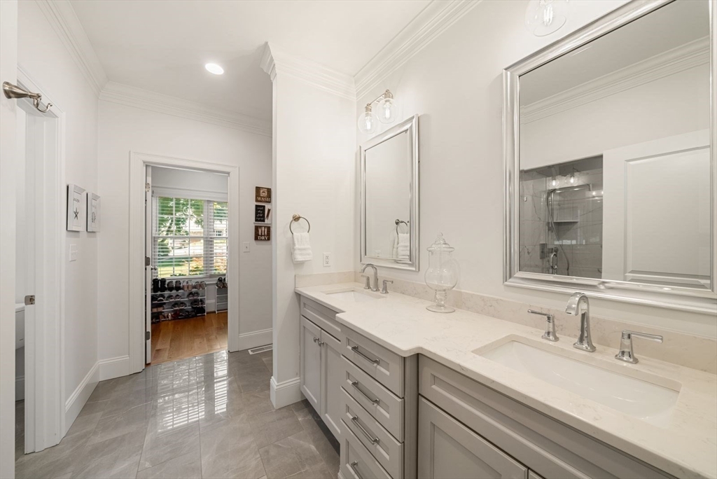 185 Bailey Street Canton, MA 02021 - Photo 20 of 42 a spacious bathroom with a double vanity sink a mirror and next to a window