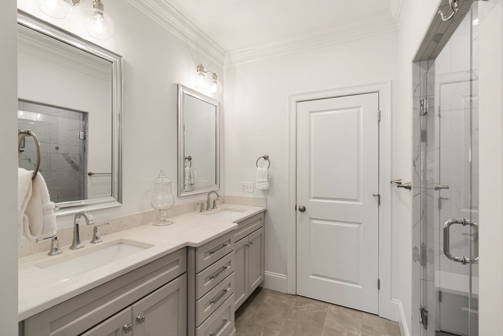 185 Bailey Street Canton, MA 02021 - Photo 21 of 42 a bathroom with double vanity sinks and a mirror