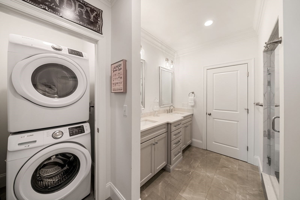 185 Bailey Street Canton, MA 02021 - Photo 22 of 42 a view of a hallway with washer and dryer