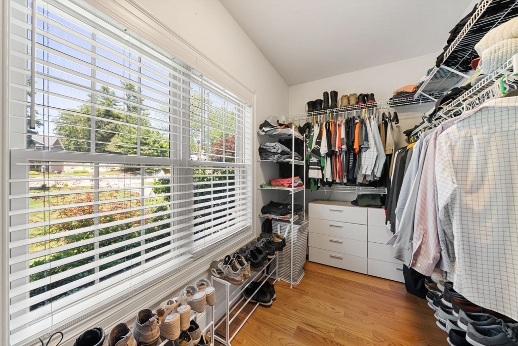 185 Bailey Street Canton, MA 02021 - Photo 23 of 42 a view of walk in closet with clothes and shoes