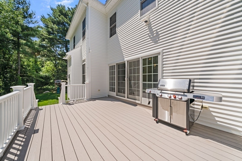 185 Bailey Street Canton, MA 02021 - Photo 40 of 42 a view of a roof deck with wooden floor and fence