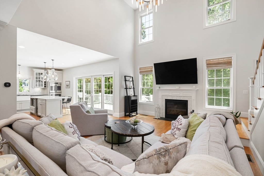 185 Bailey Street Canton, MA 02021 - Photo 6 of 42 a living room with furniture fireplace and a flat screen tv
