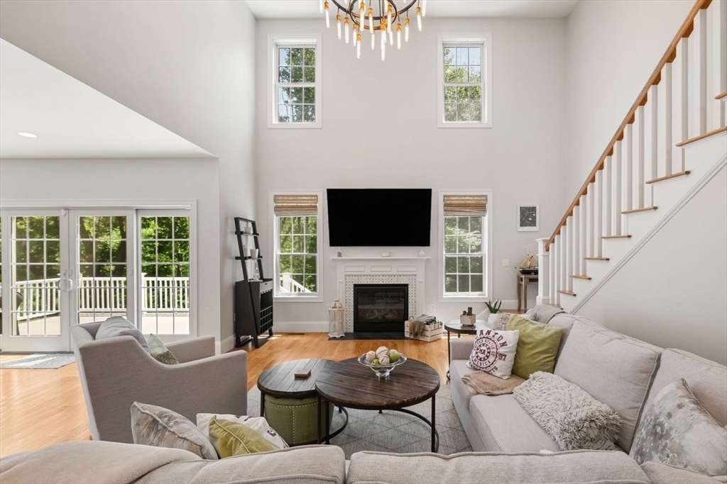 185 Bailey Street Canton, MA 02021 - Photo 7 of 42 a living room with fireplace furniture and a flat screen tv
