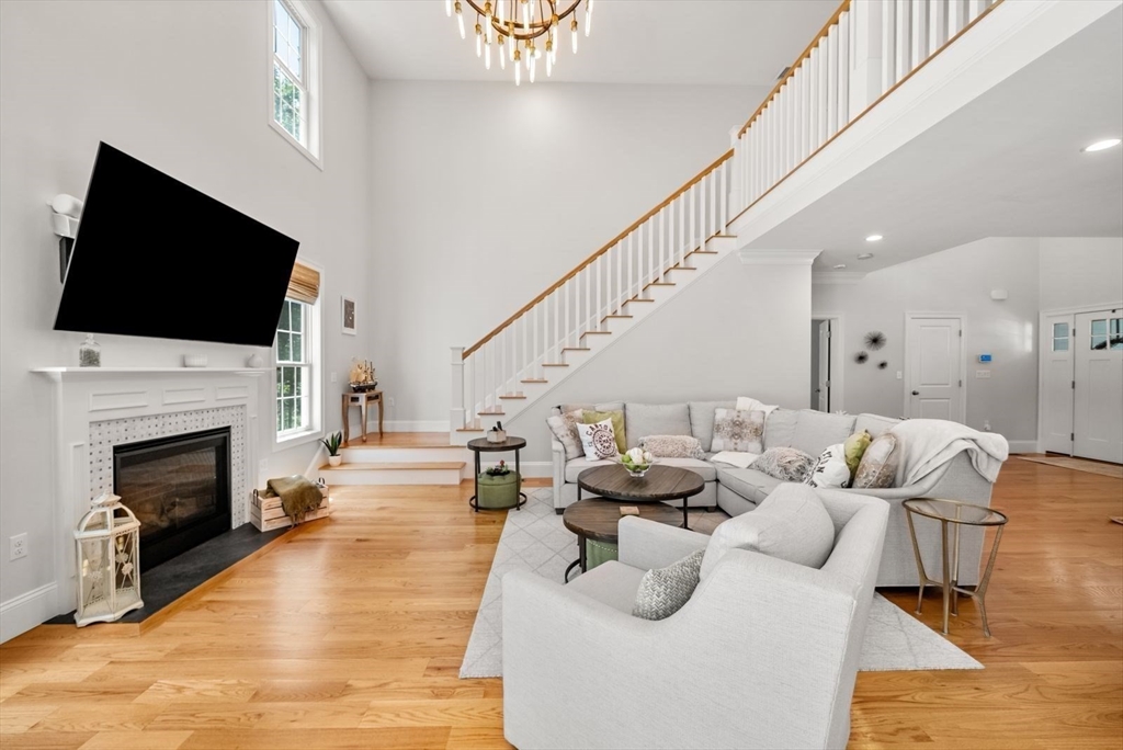 185 Bailey Street Canton, MA 02021 - Photo 8 of 42 a living room with furniture or fireplace and a flat screen tv