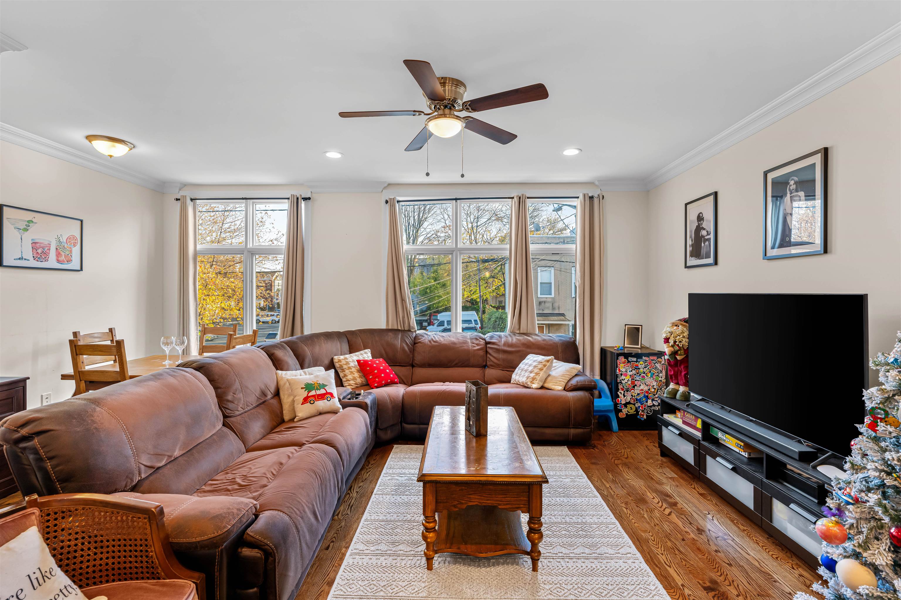 193 Halladay Street Jersey City, NJ 07304 - Photo 24 of 49 a living room with furniture a flat screen tv and a large window