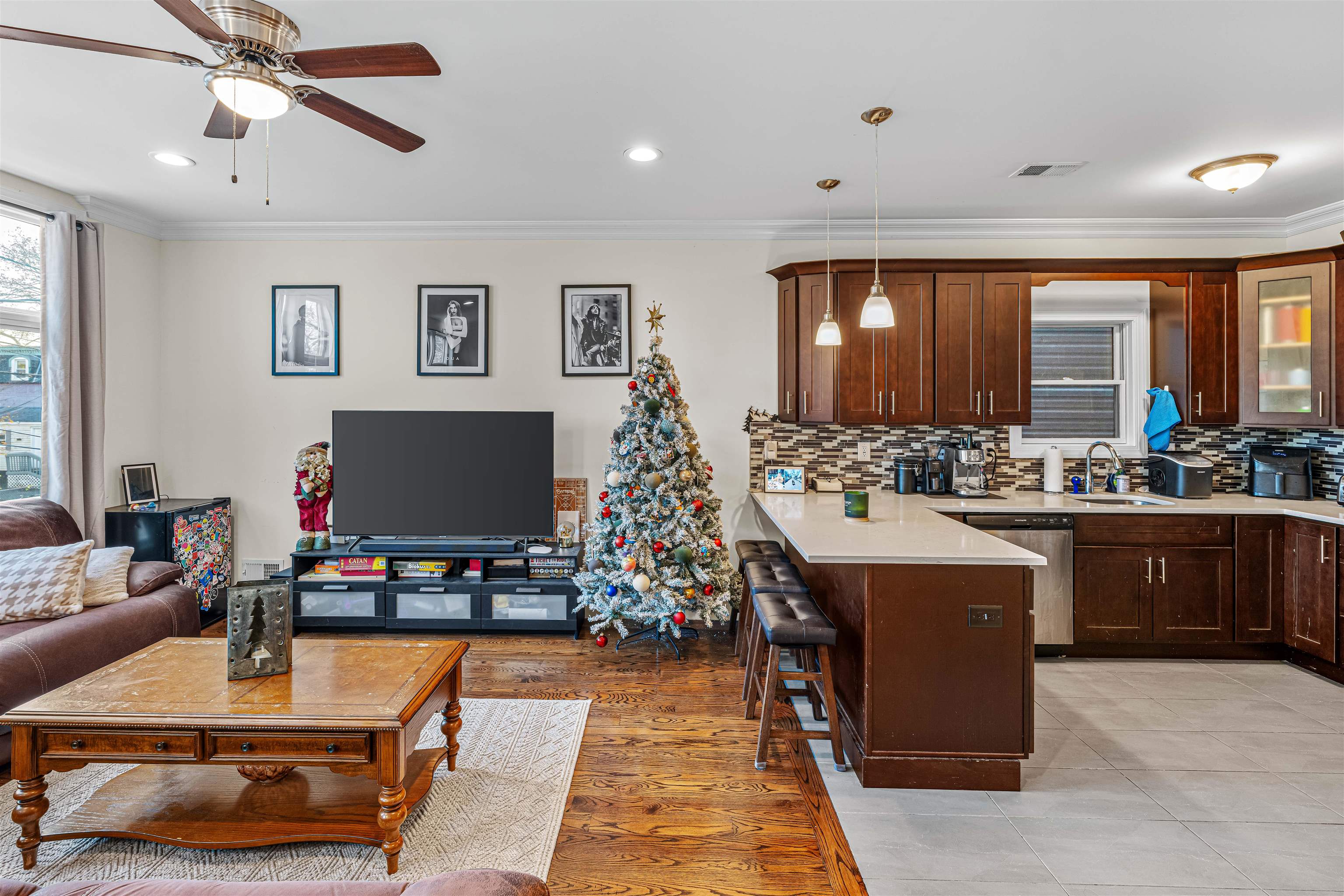 193 Halladay Street Jersey City, NJ 07304 - Photo 26 of 49 a room with kitchen island granite countertop a stove and a flat screen tv