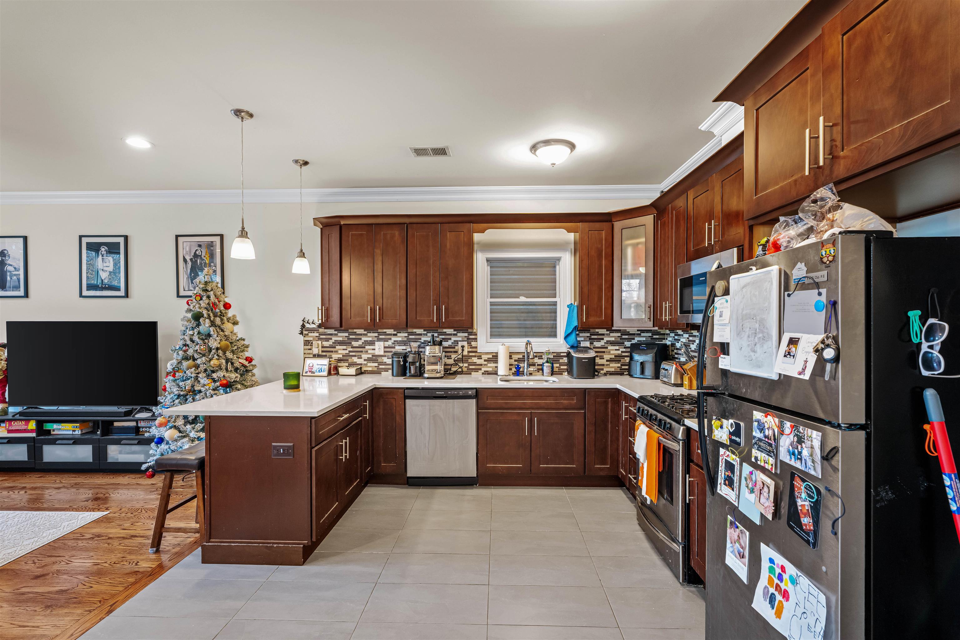 193 Halladay Street Jersey City, NJ 07304 - Photo 29 of 49 a large kitchen with stainless steel appliances granite countertop a lot of counter space and a sink