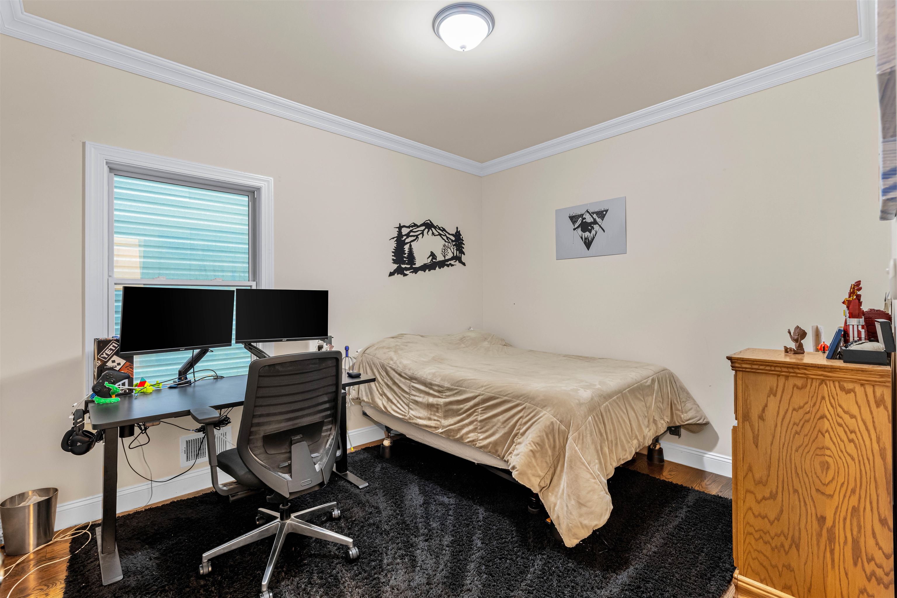 193 Halladay Street Jersey City, NJ 07304 - Photo 33 of 49 a bedroom with a bed and a computer on a desk