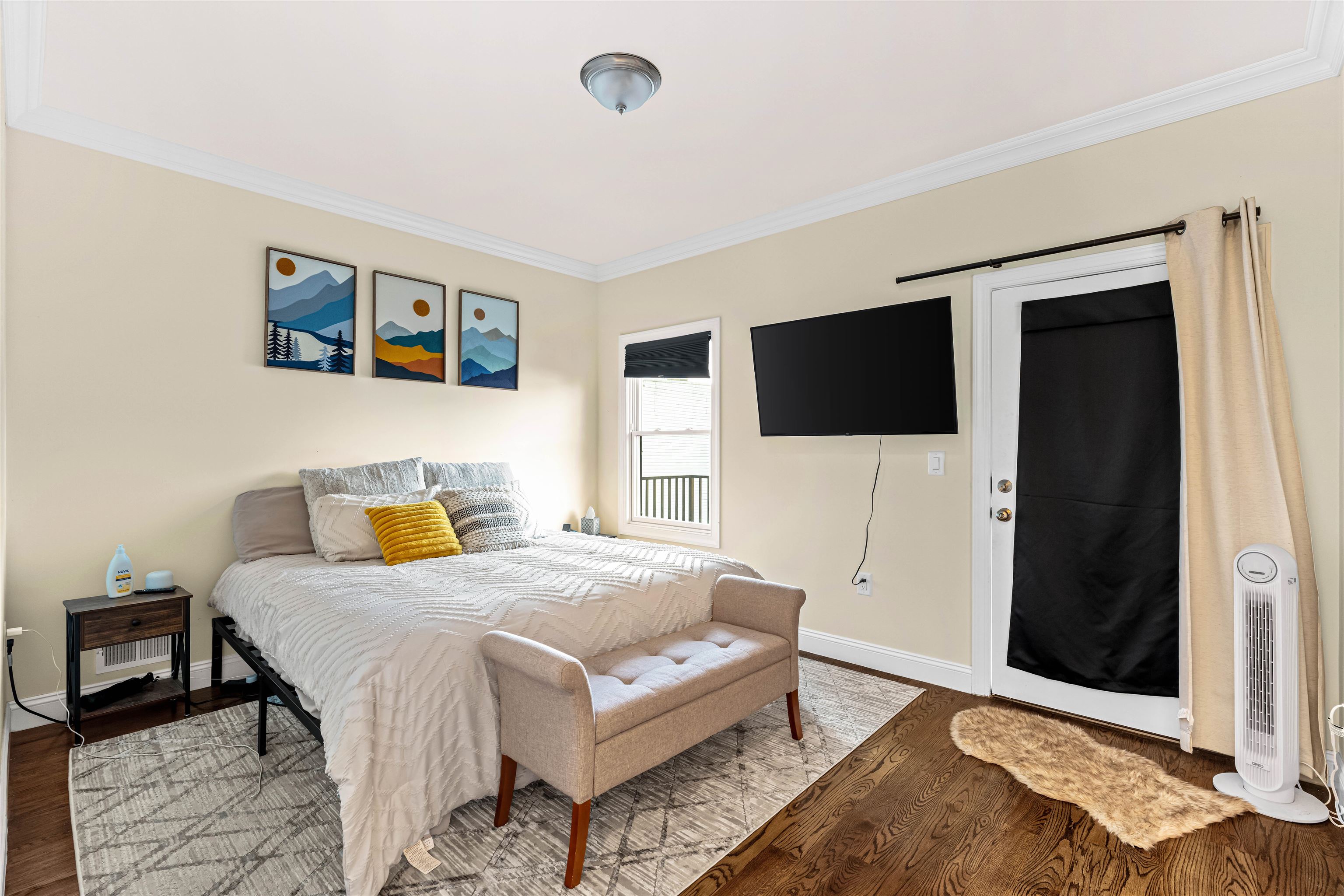 193 Halladay Street Jersey City, NJ 07304 - Photo 38 of 49 a bedroom with a bed and a flat screen tv