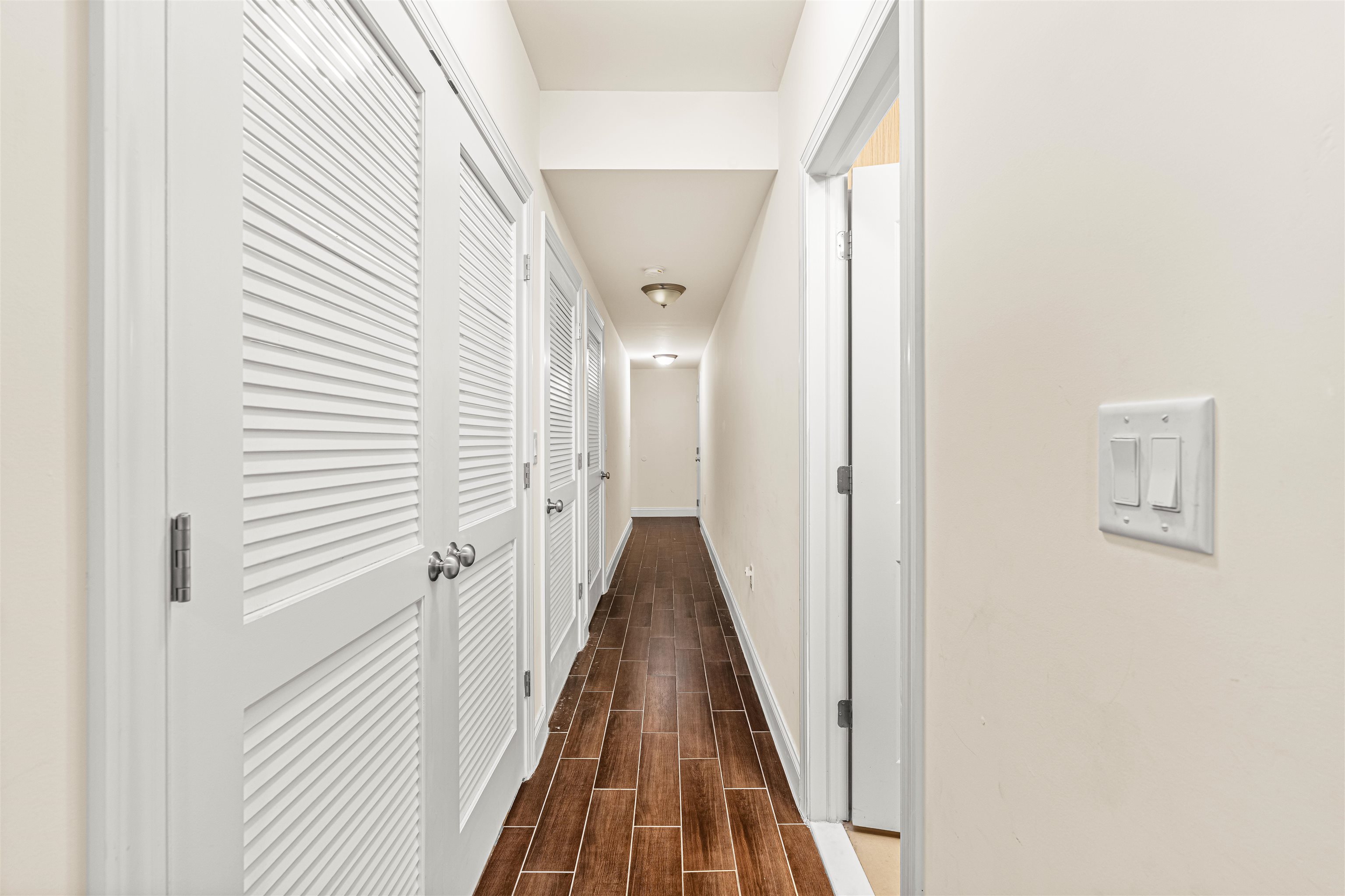 193 Halladay Street Jersey City, NJ 07304 - Photo 40 of 49 a view of a hallway with wooden floor and staircase