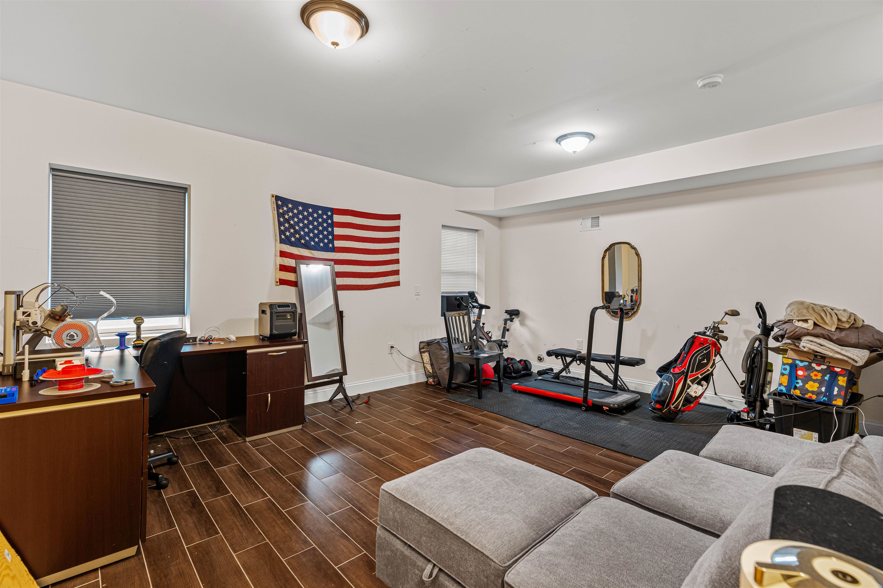 193 Halladay Street Jersey City, NJ 07304 - Photo 41 of 49 a living room with furniture gym equipment and a flat screen tv