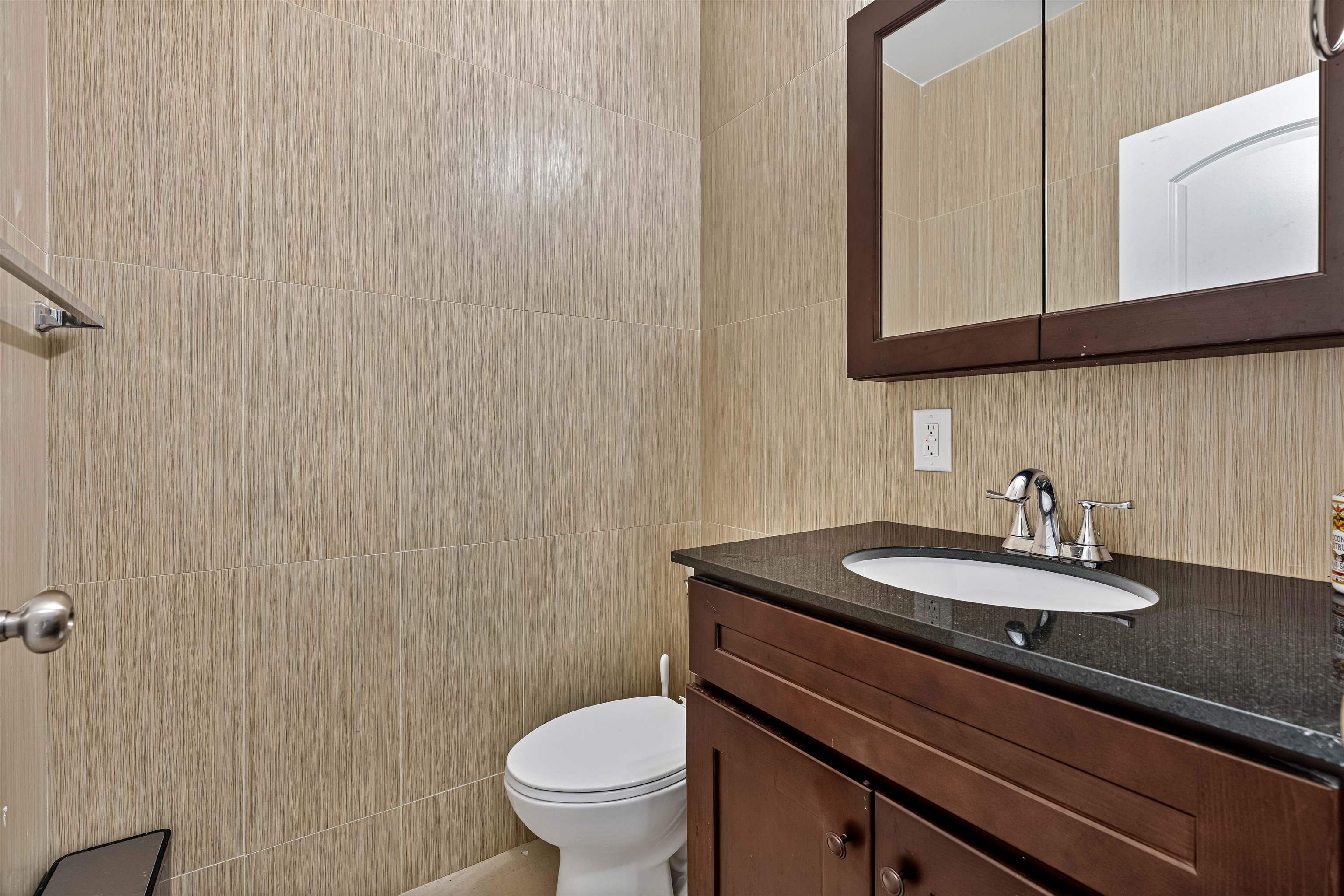 193 Halladay Street Jersey City, NJ 07304 - Photo 43 of 49 a bathroom with a granite countertop sink a toilet and mirror