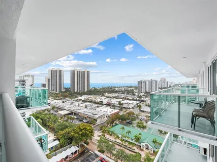 a view of a livingroom with furniture and a flat screen tv