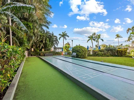 a view of a patio with table and chairs and potted plants